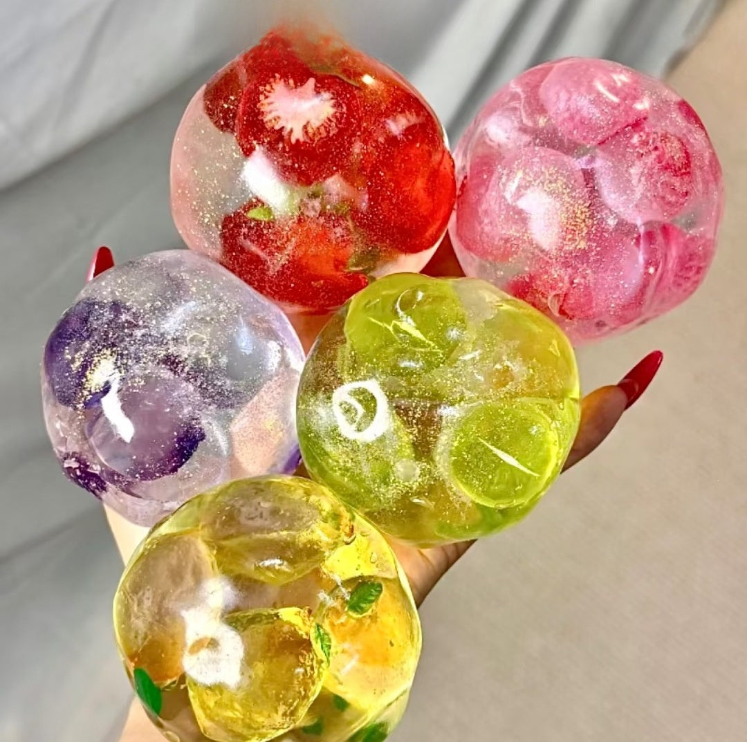 Handmade coconut oil glass fruit squishy ball